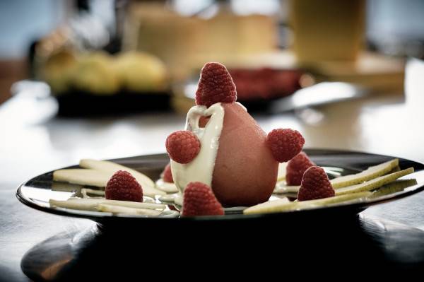 Pears glazed with fresh asiago pdo and raspberries